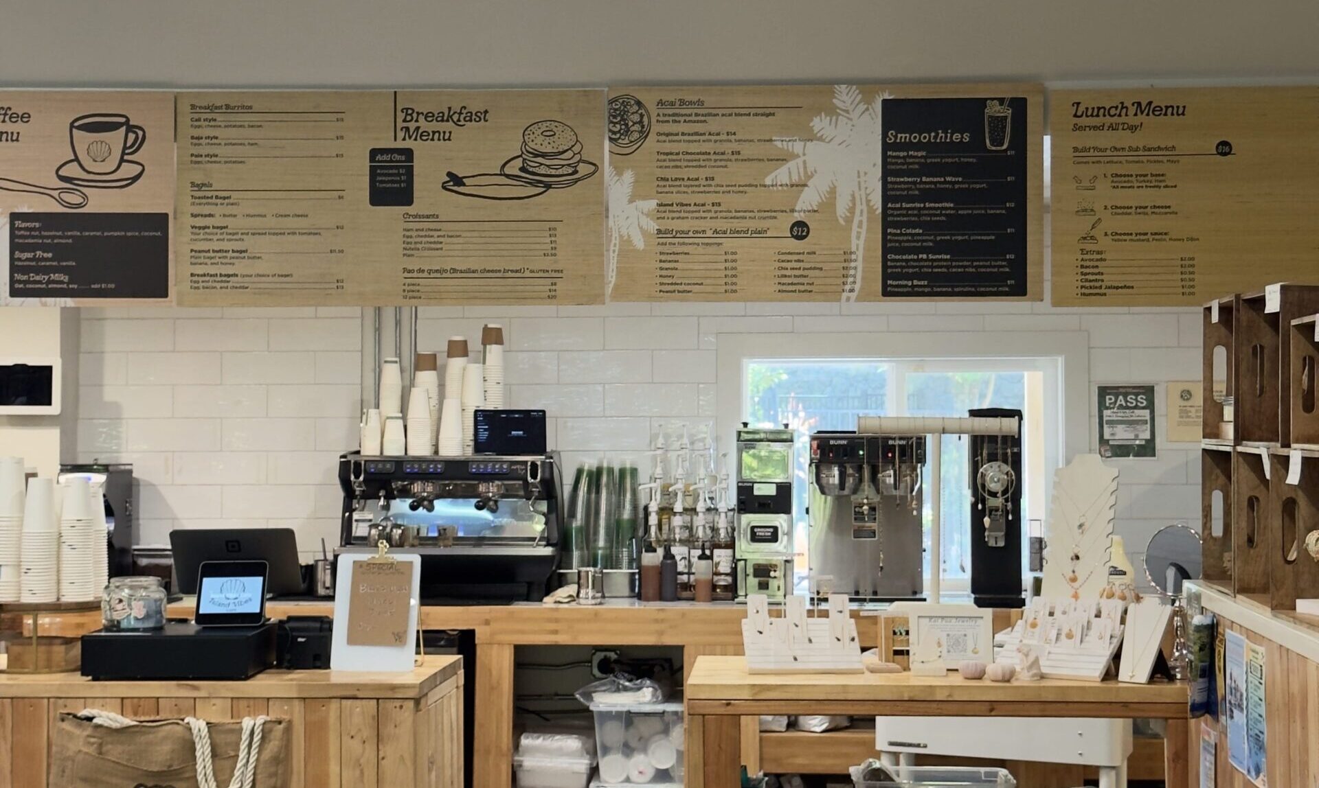 Napili Village Hotel, Interior of Island Vibes coffee shop in Napili, Maui. Breakfast and lunch menu boards are visible.